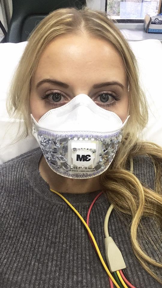 The 27-year-old wears a facemask covered in diamantes whenever she needs to leave the house