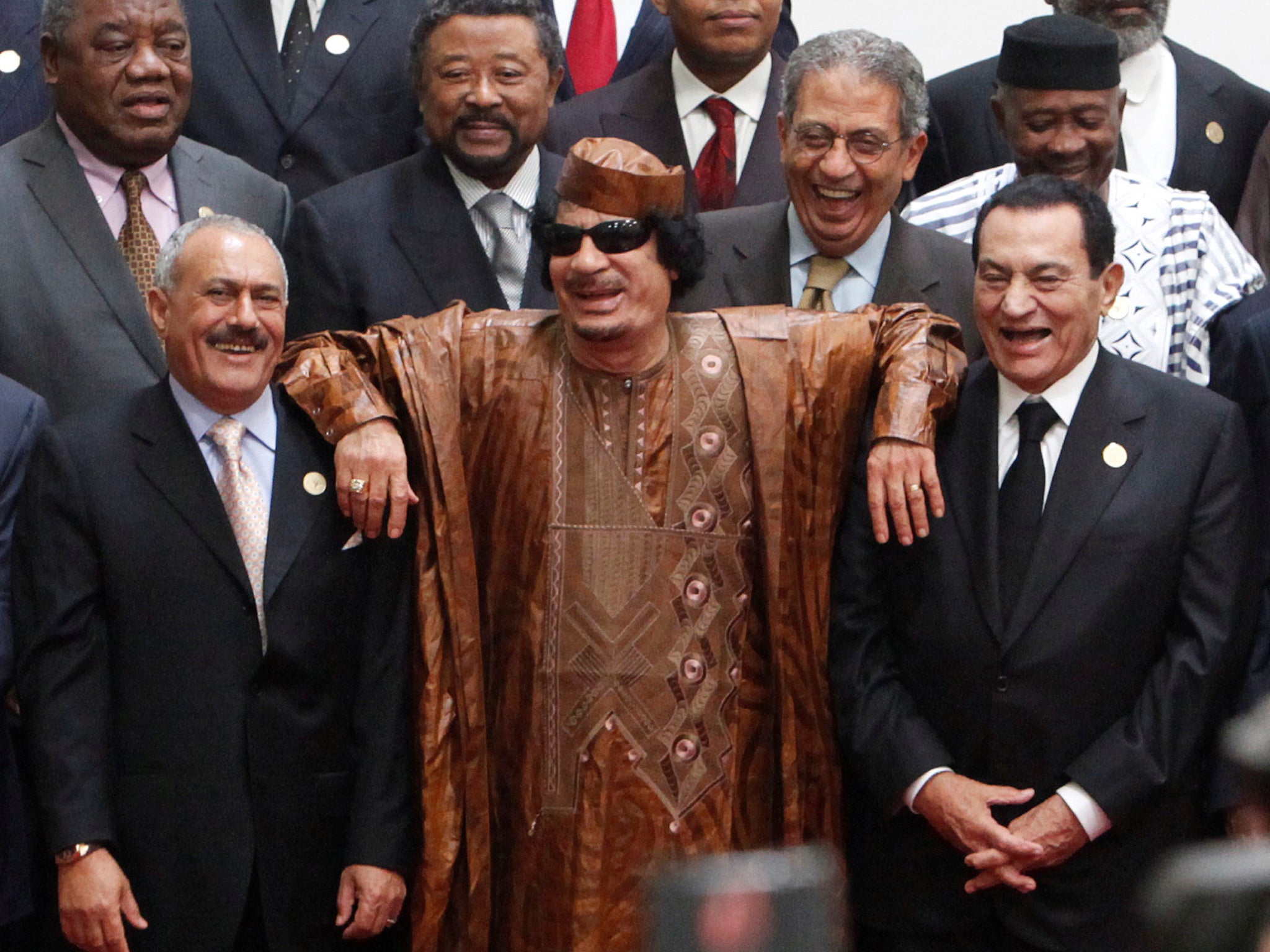 Saleh (right) with Hosni Mubarak (left) and Muammar Gaddafi at the second Afro-Arab Summit in Libya in 2010 (Reuters)