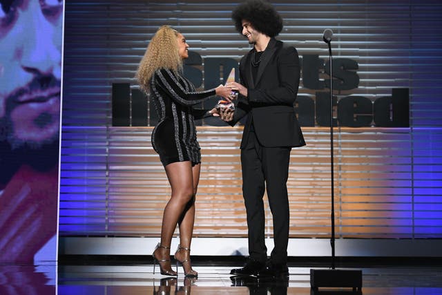 Beyonce presents Colin Kaepernick with the Sports Illustrated Muhammad Ali Legacy award at the 2017 Sportsperson of the Year in New York