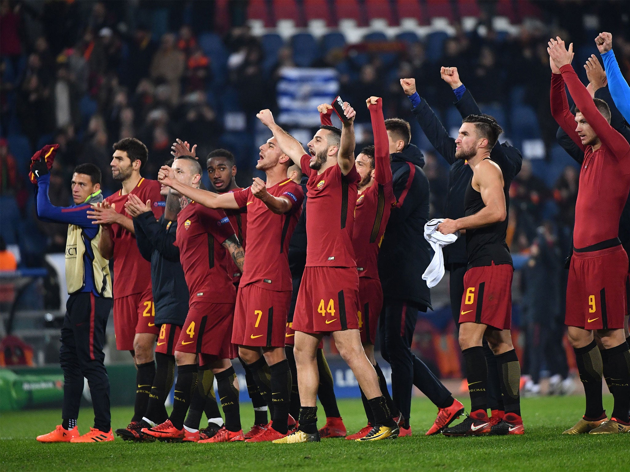 Roma celebrate topping their Champions League group