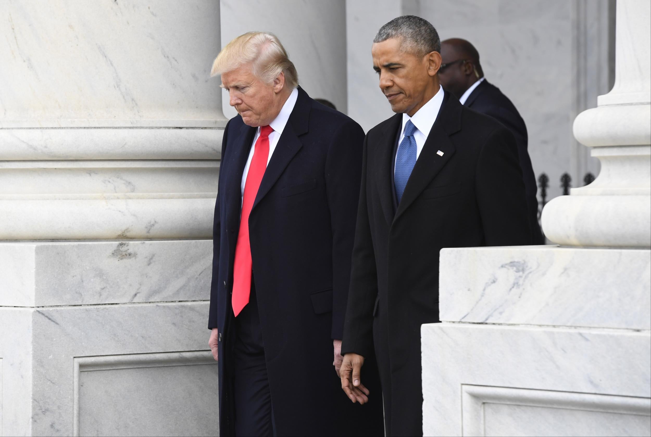 President Donald Trump and former President Barack Obama walk out prior to Obama's departure during the 2017 presidential inauguration
