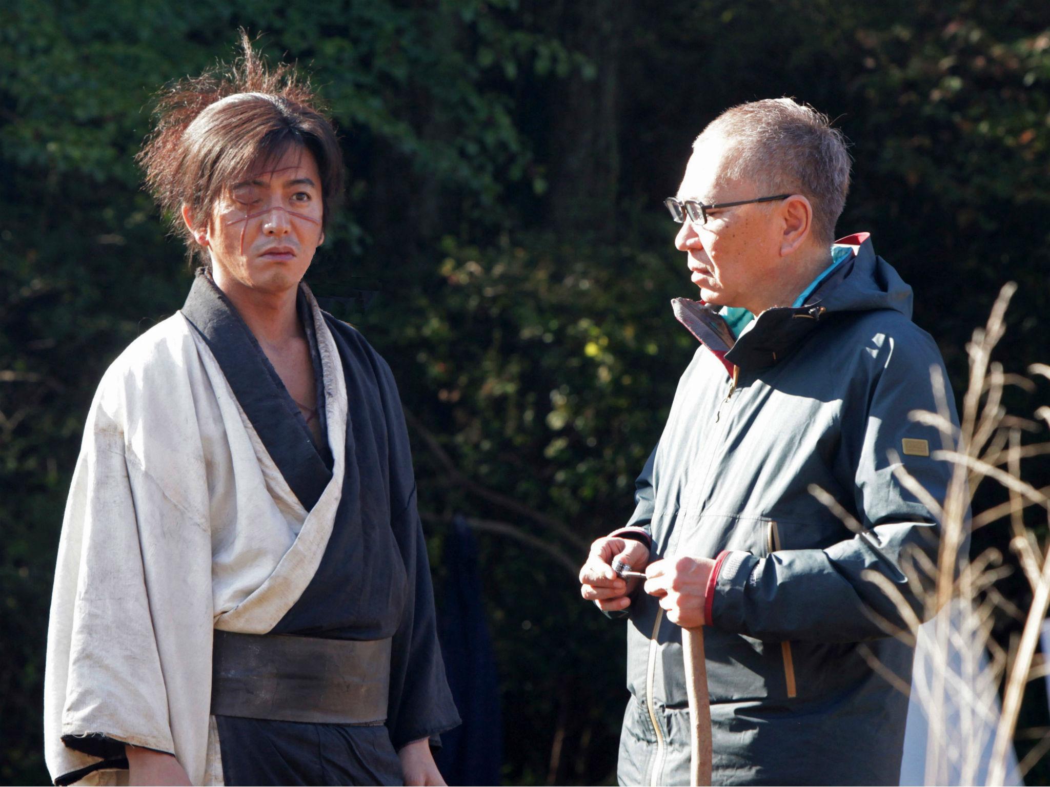 Director Miike (right) on set of 'Blade of the Immortal' with Takuya Kimura, who plays Manji