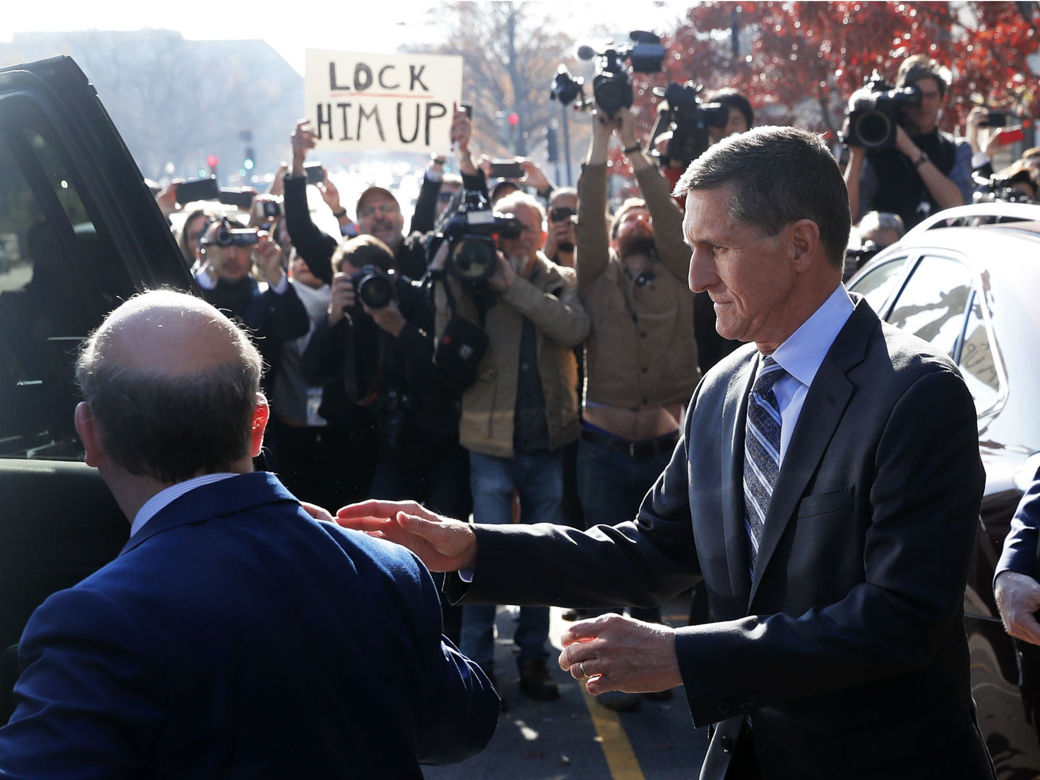 Michael Flynn departs US District Court after pleading guilty to lying to the FBI about his contacts with Russia's ambassador to the United States on December 1, 2017
