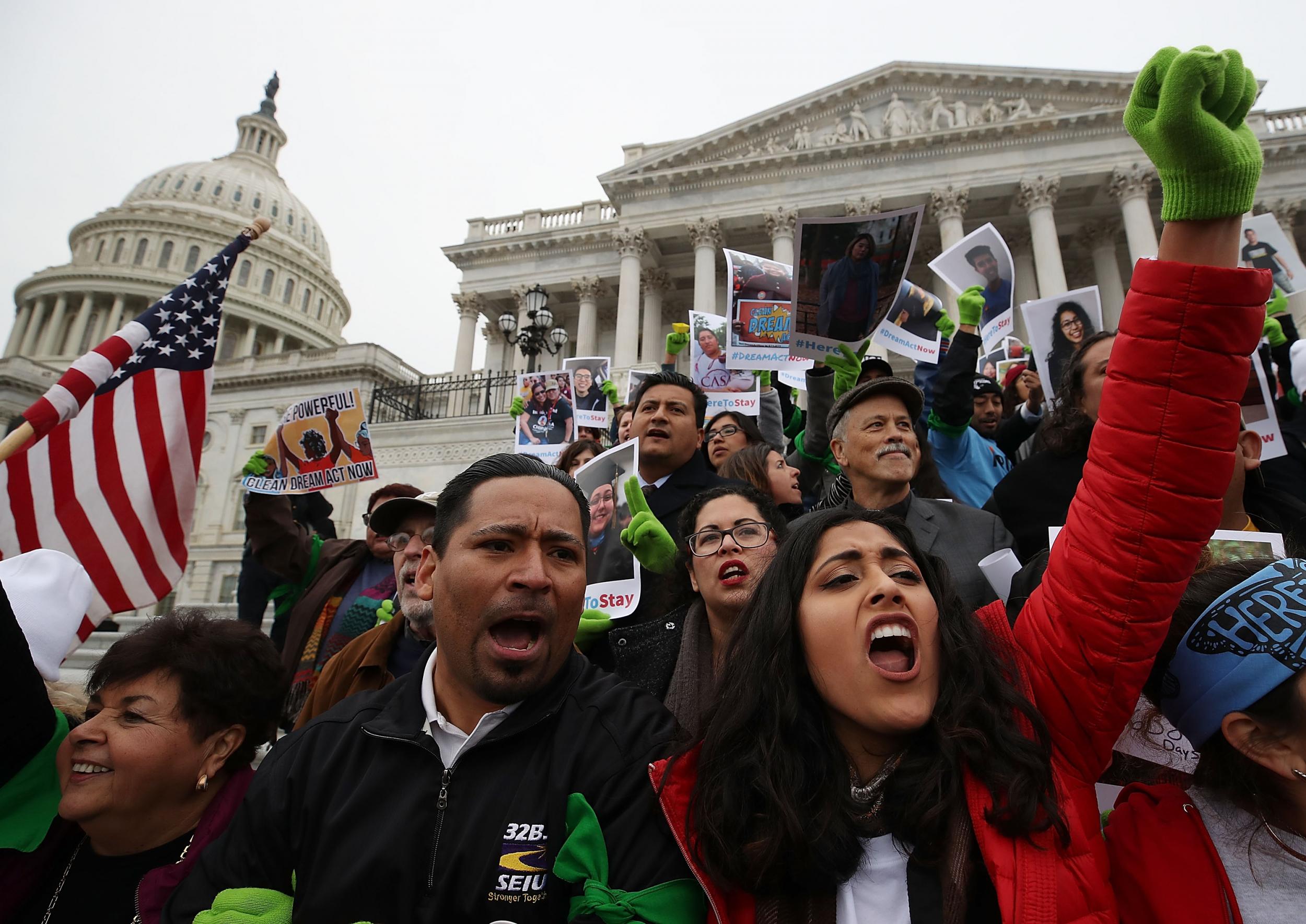 Protesters chant outside the Senate chambers, urging Congress to pass the Dream Act
