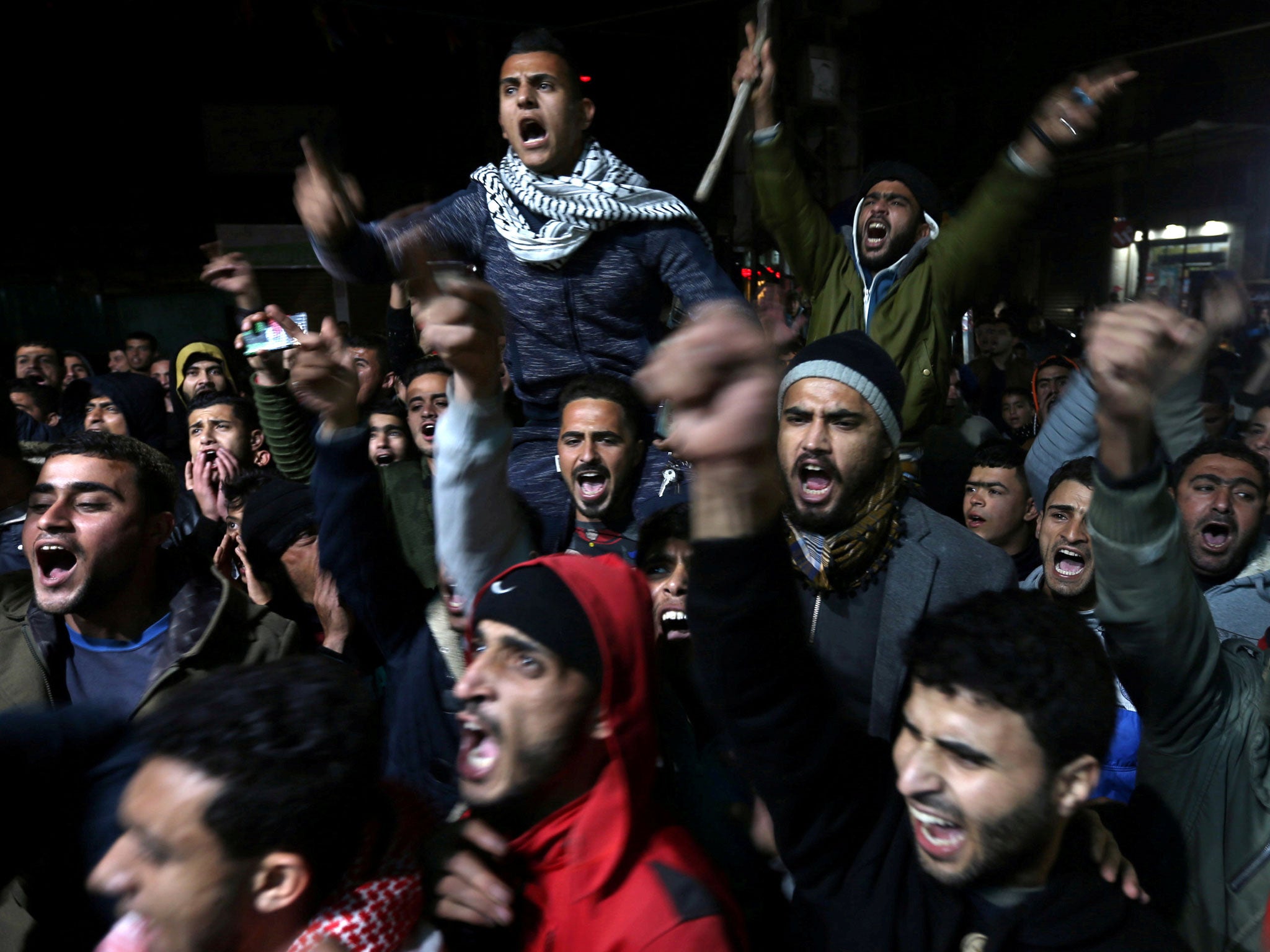 Palestinians react during a protest against Donald Trump's decision to recognise Jerusalem as Israel's capital, in Khan Younis in the southern Gaza Strip