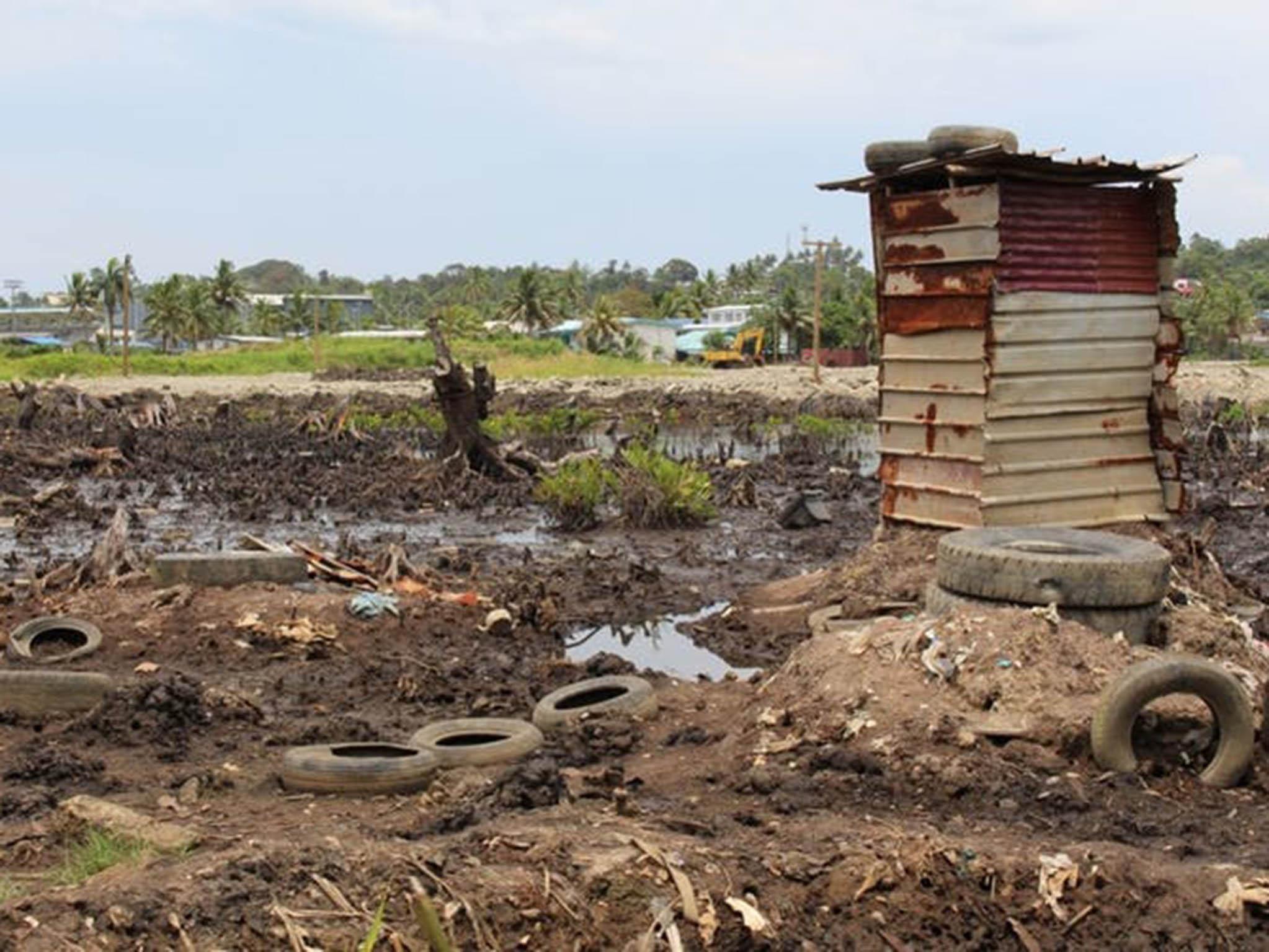 An unsafe toilet next to an informal settlement in Fiji