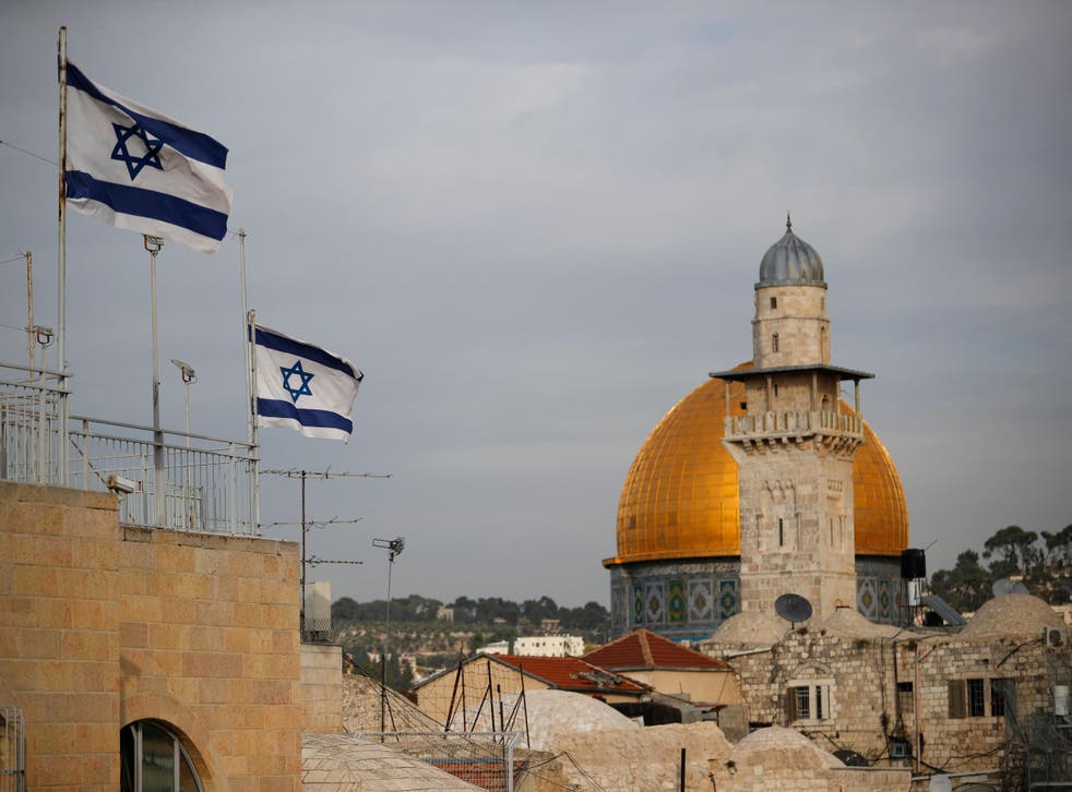 Israeli flags fly near the Dome of the Rock in the Al-Aqsa mosque compound in Jerusalem on 5 December 2017