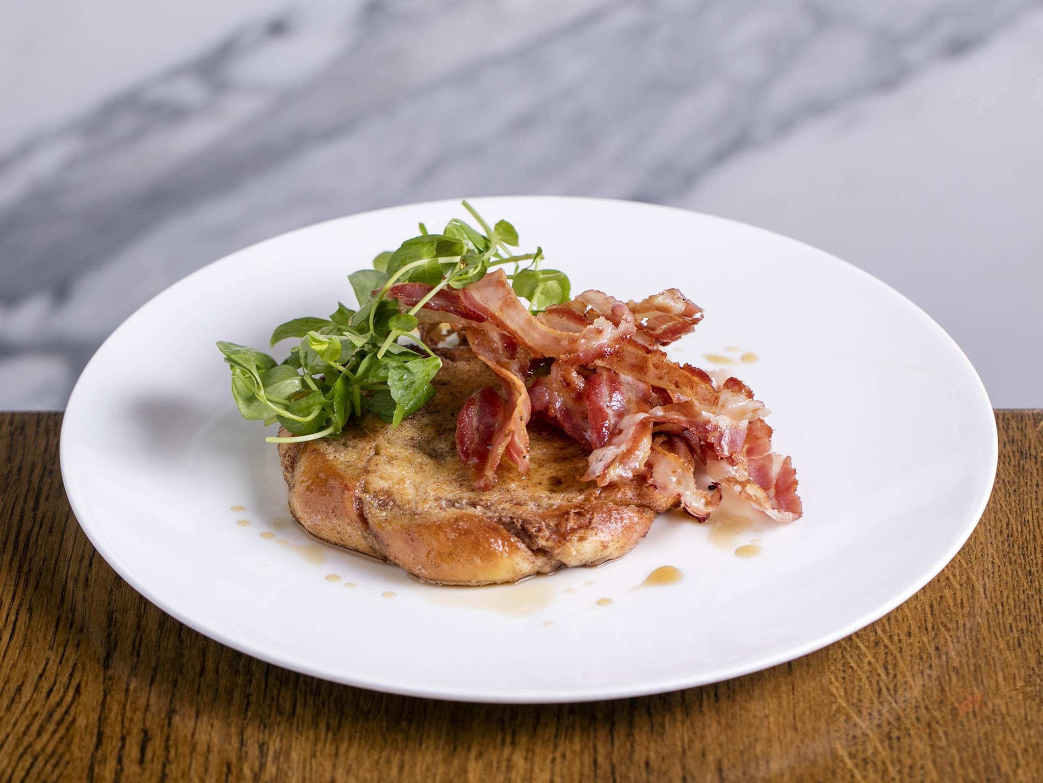 Cinnamon bun French toast with bacon is one of the options on Aster’s brunch menu