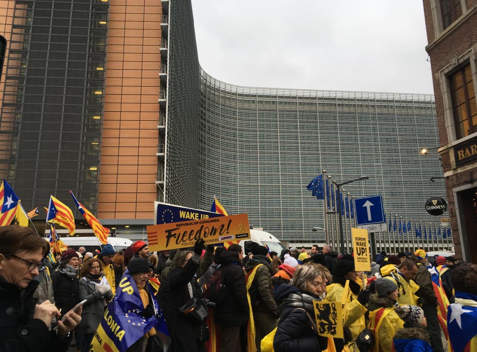 Pro-Catalan independence protesters march past the Berlaymont building, headquarters of the European Commission 