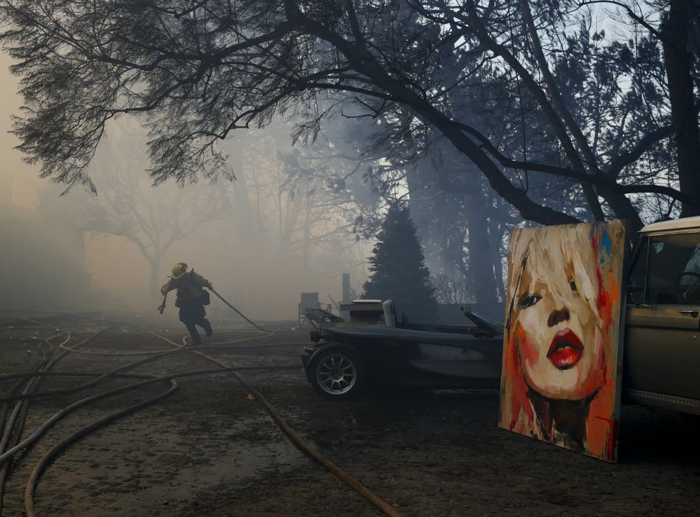 Firefighters have saved a number of paintings and other possessions in Bel Air