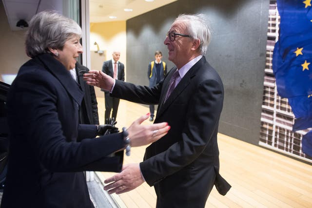 EU President Jean-Claude Juncker greeting Theresa May at the EU Commission in Brussels