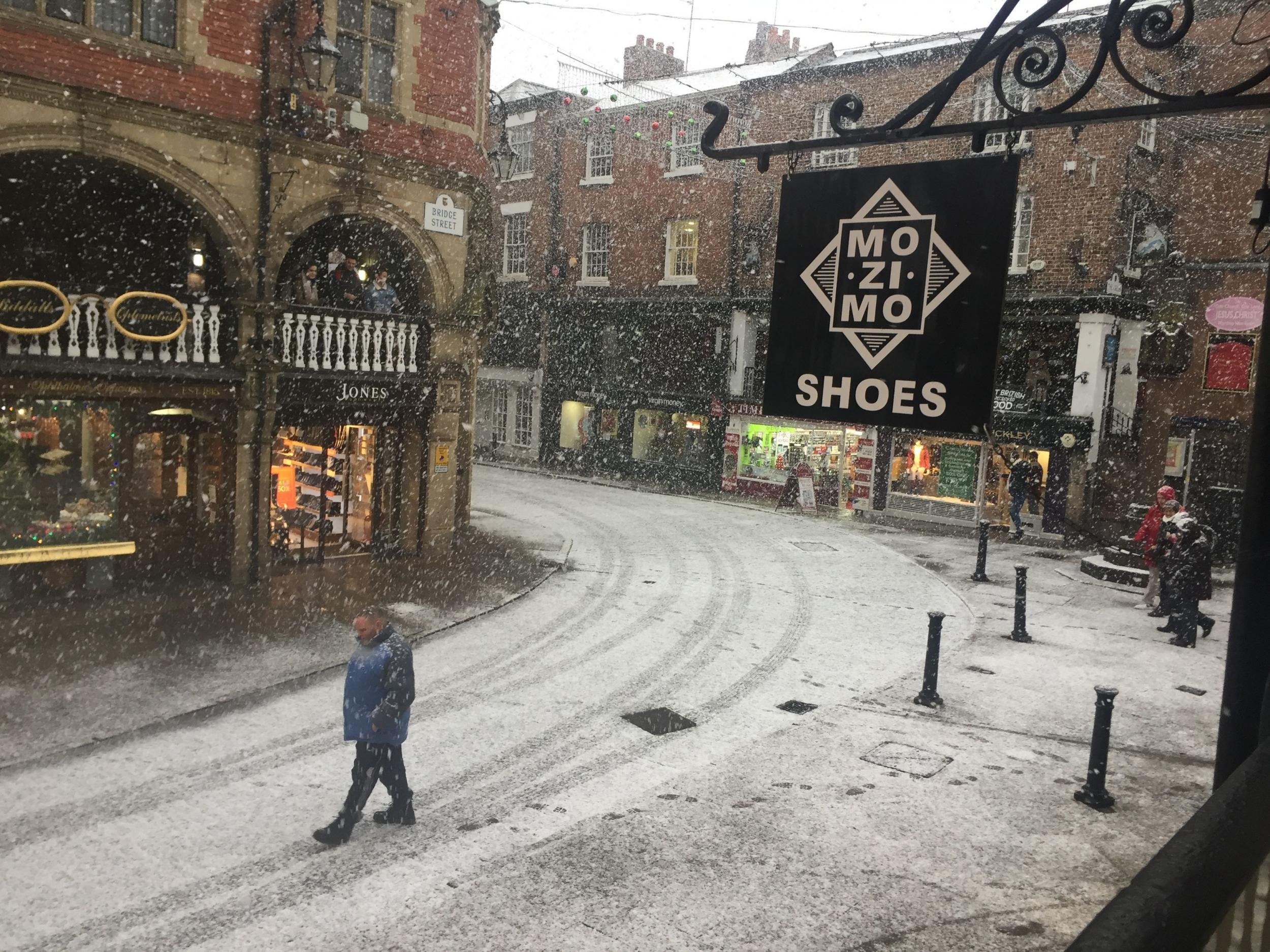 Snow falls in Chester, as parts of Britain woke up to a blanket of snow