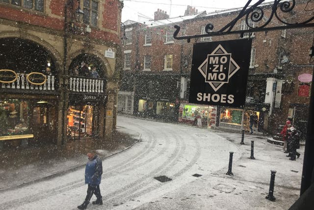 Snow falls in Chester, as parts of Britain woke up to a blanket of snow