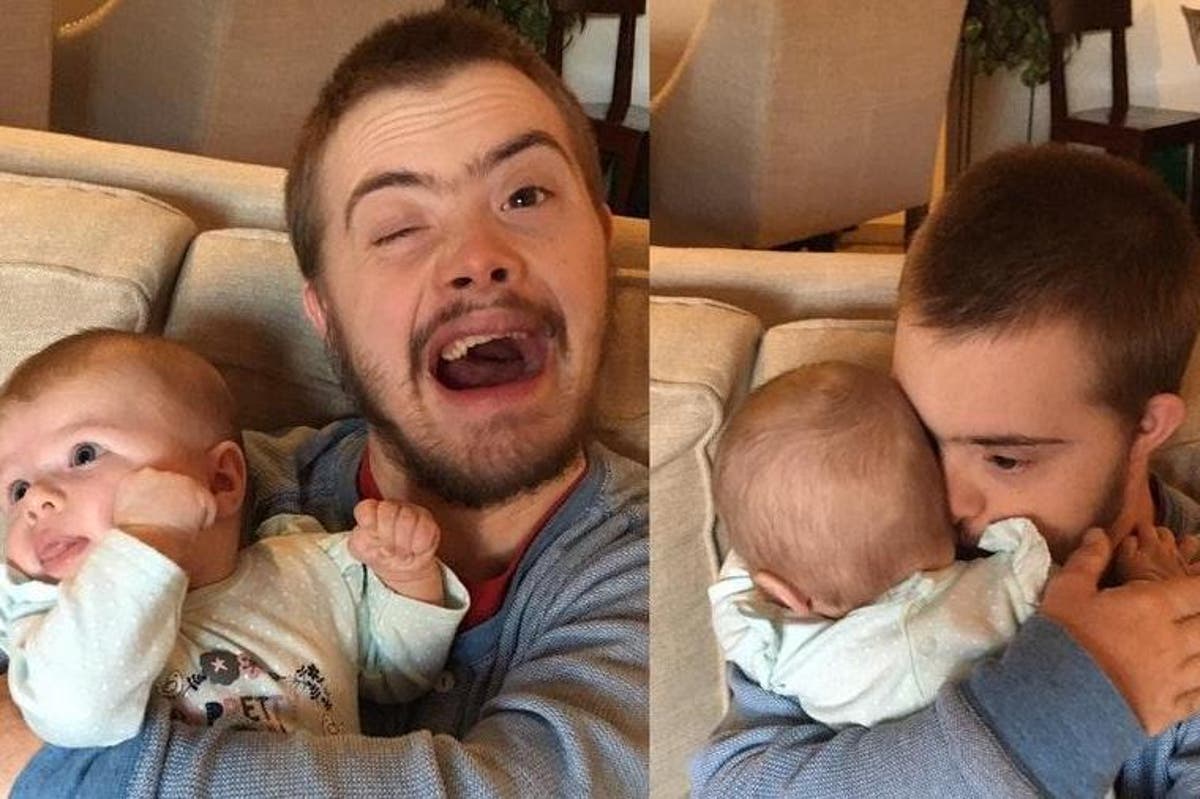 Photo Of Man With Down S Syndrome Holding Newborn Baby Goes Viral For Heartwarming Reason The Independent The Independent