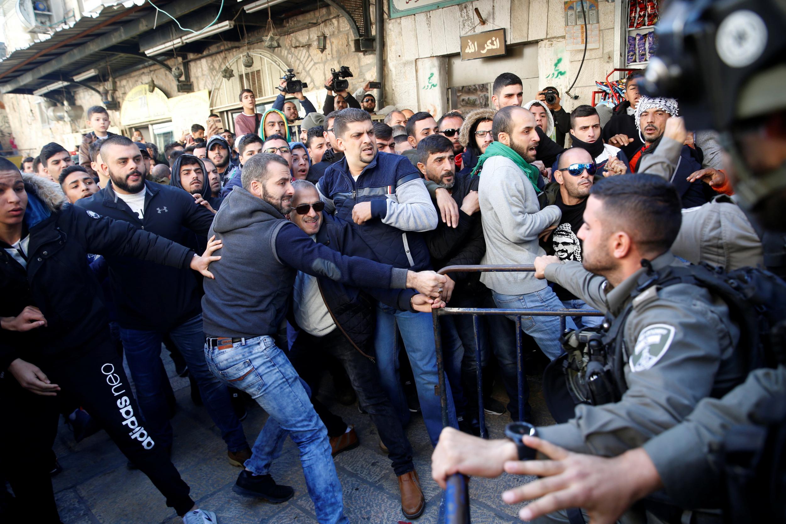 Israeli border police and Palestinians scuffle after Friday prayers in Jerusalem's Old City