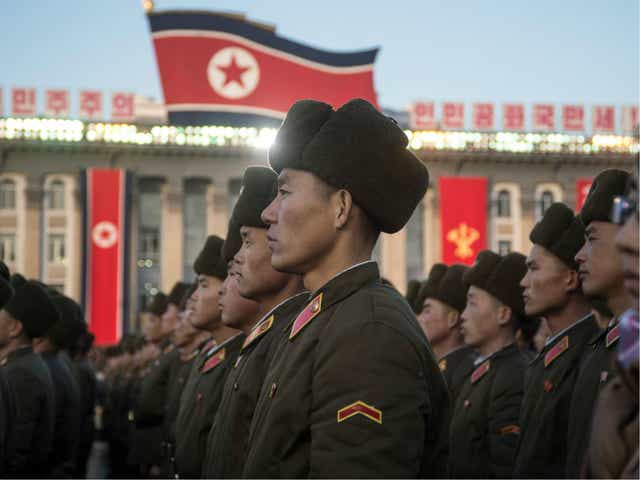 North Korean soldiers attend a mass rally