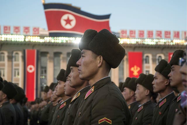 North Korean soldiers attend a mass rally