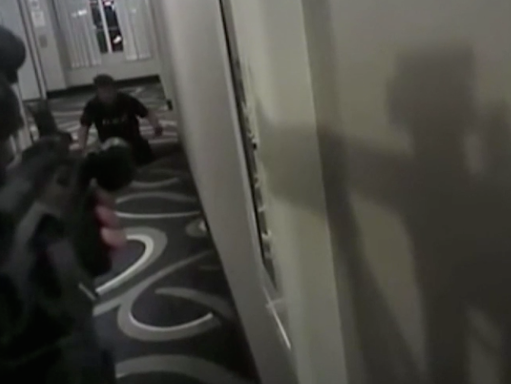 Daniel Shaver is seen putting his hands up before police shoot him