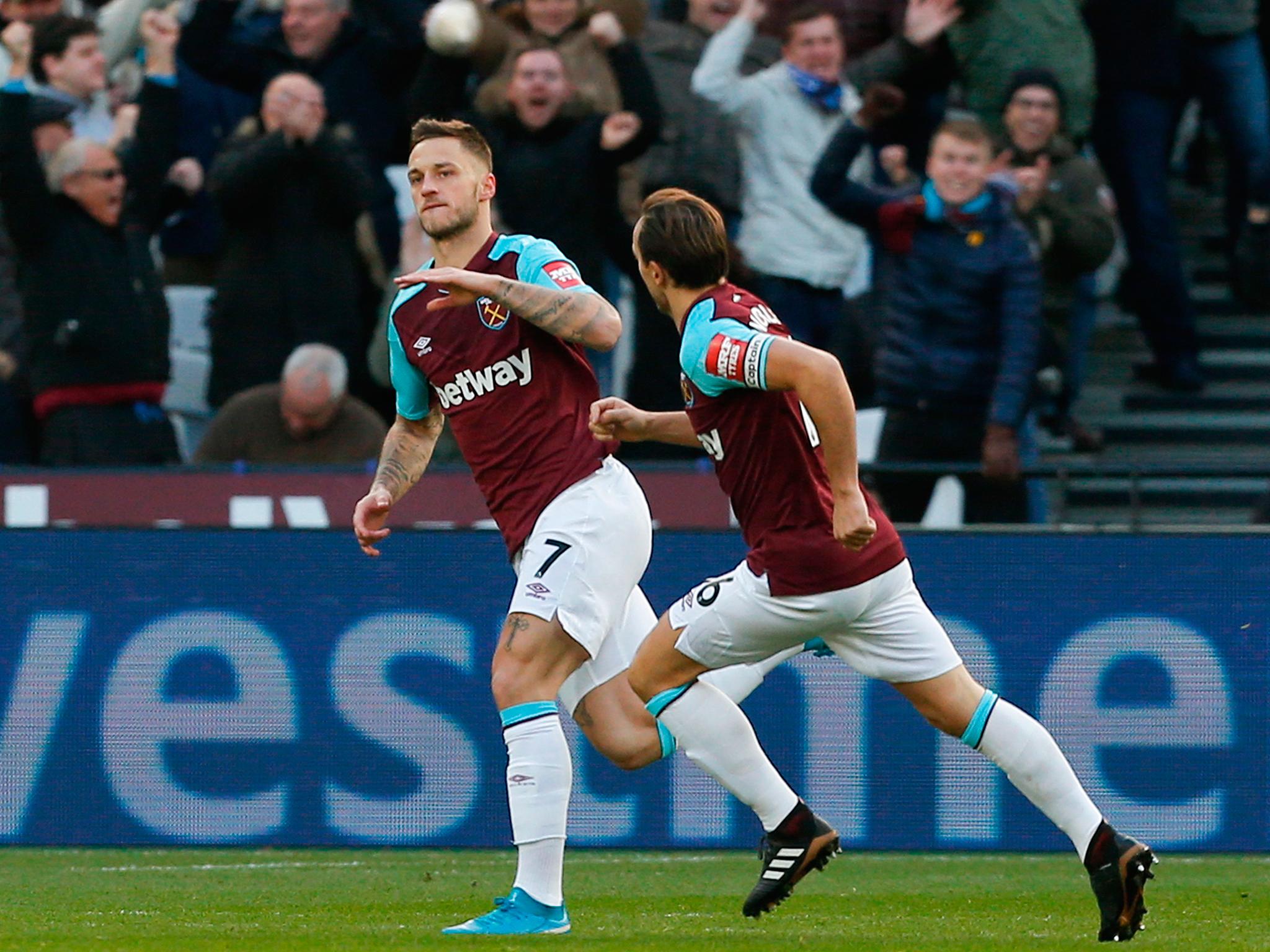 Marko Arnautovic celebrates scoring the opener for West Ham against Chelsea