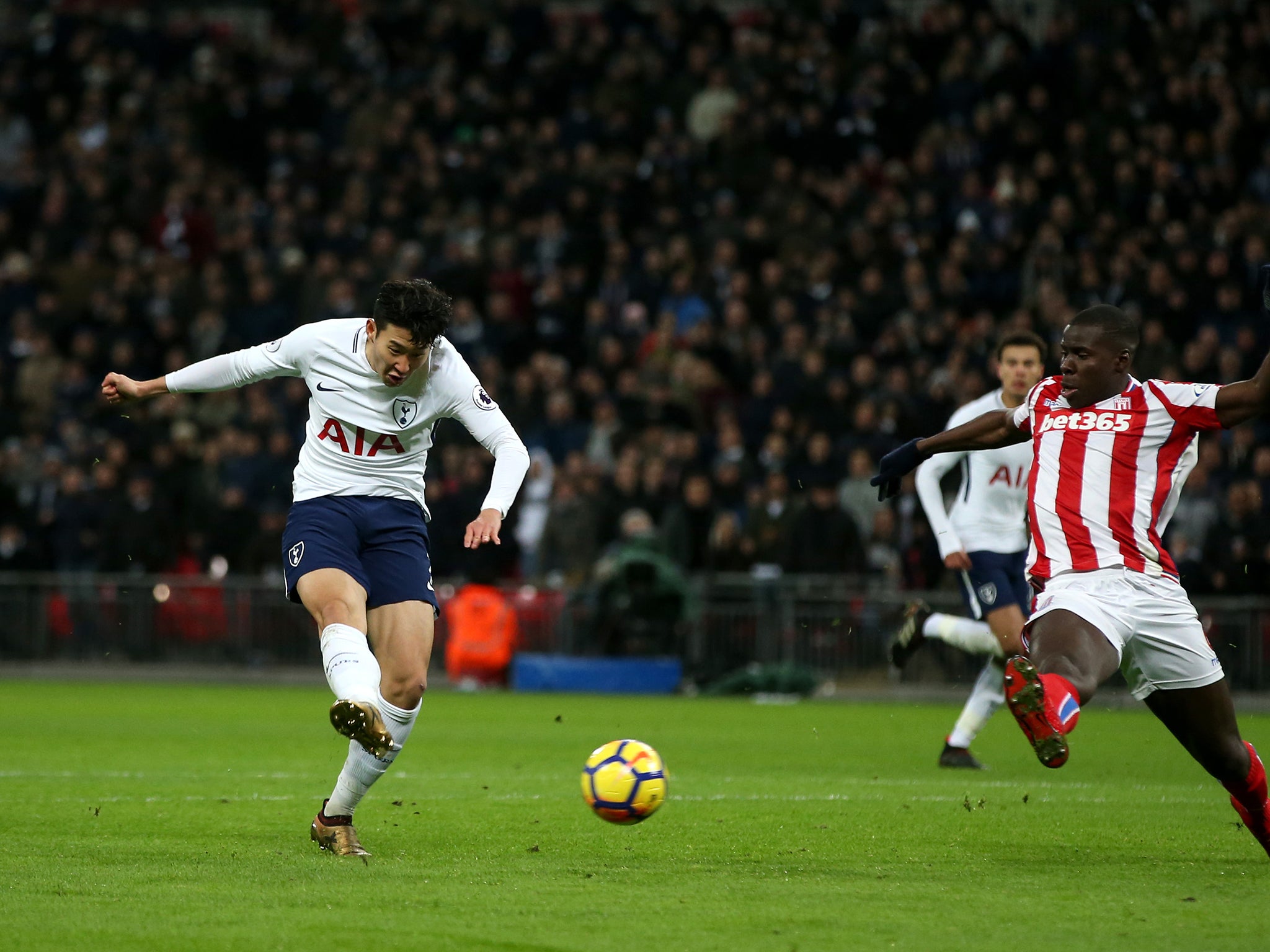 Son Heung-min fires into the back of the net to score Tottenham's second against Stoke