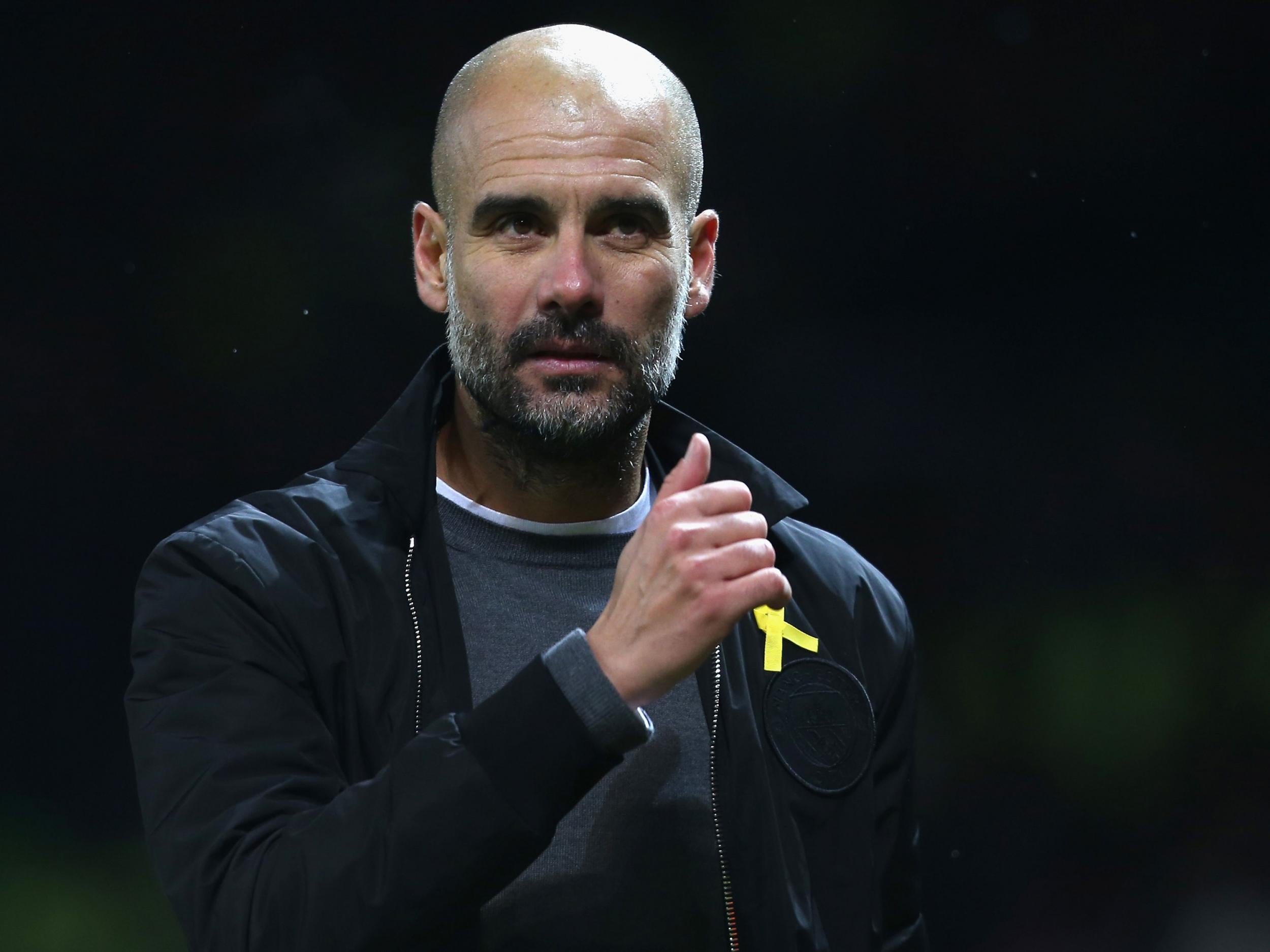 Pep Guardiola wore the yellow ribbon during Sunday's Manchester derby