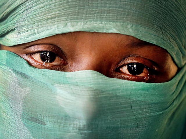 F, 22, who says she was raped by members of Burma's armed forces in June and again in September, is photographed in her tent in Kutupalong refugee camp in Bangladesh