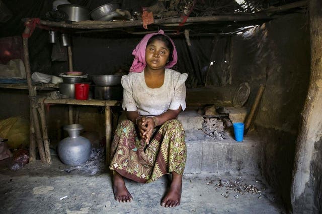 Sunuara, 25, poses for a photo in Cox's Bazar, Bangladesh