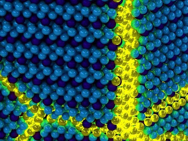 Artist's depiction of the collective excitons of an excitonic solid. The yellow sections signify the 'excitations' in an otherwise ordered solid exciton background