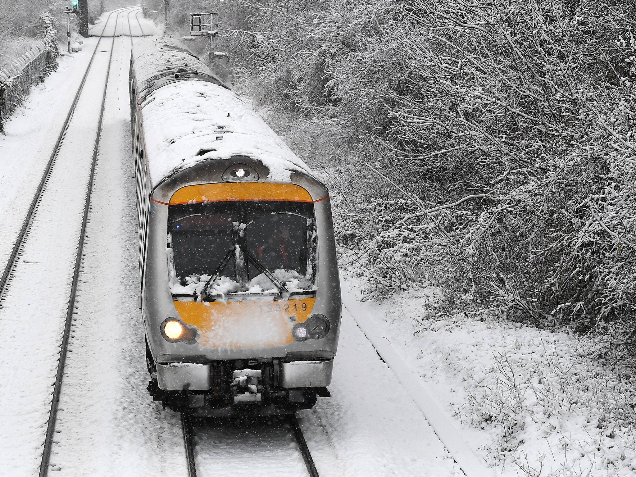 A train travels through snow at High Wycombe, west of London