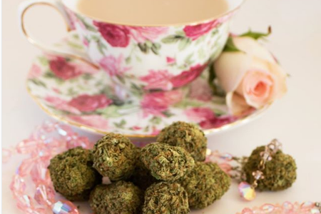 Marijuana buds are painstakingly arranged next to bone china at the tea party