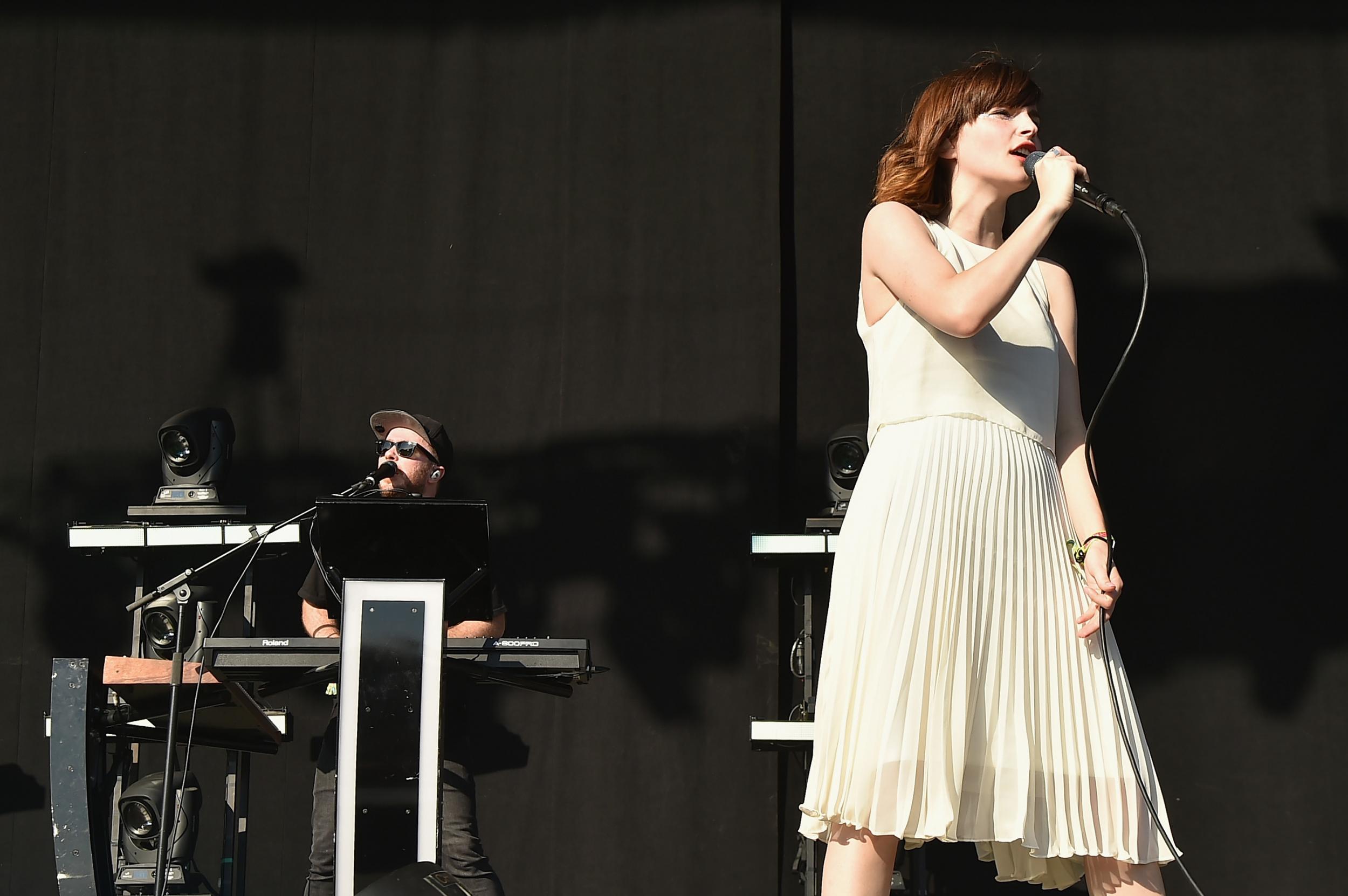 Recording artist Lauren Mayberry (L) and Martin Doherty of Chvrches performs onstage at Firefly Music Festival on June 18, 2016 in Dover, Delaware. Credit: Theo Wargo/Getty Images for Firefly.