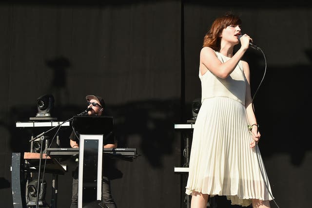 Recording artist Lauren Mayberry (L) and Martin Doherty of Chvrches performs onstage at Firefly Music Festival on June 18, 2016 in Dover, Delaware. Credit: Theo Wargo/Getty Images for Firefly.
