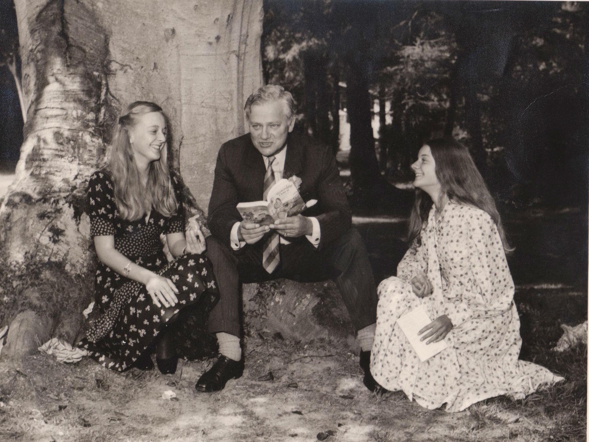 Adams reading ‘Watership Down’ with his two daughters, Juliet and Ros