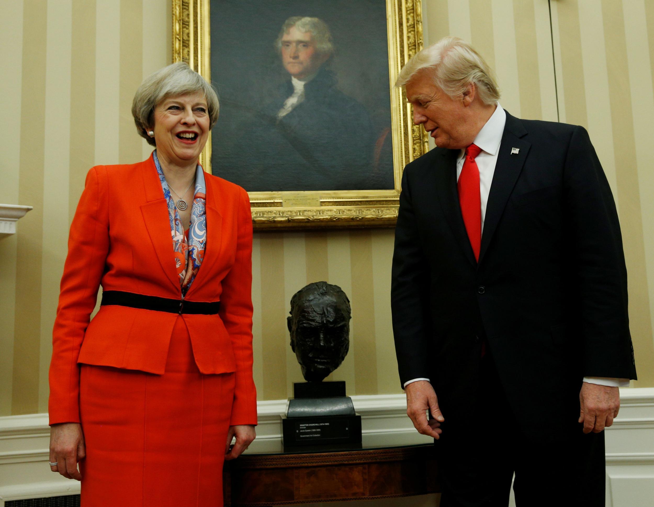 President Trump looks at Churchill bust while meeting with British Prime Minister May at the White House earlier this year