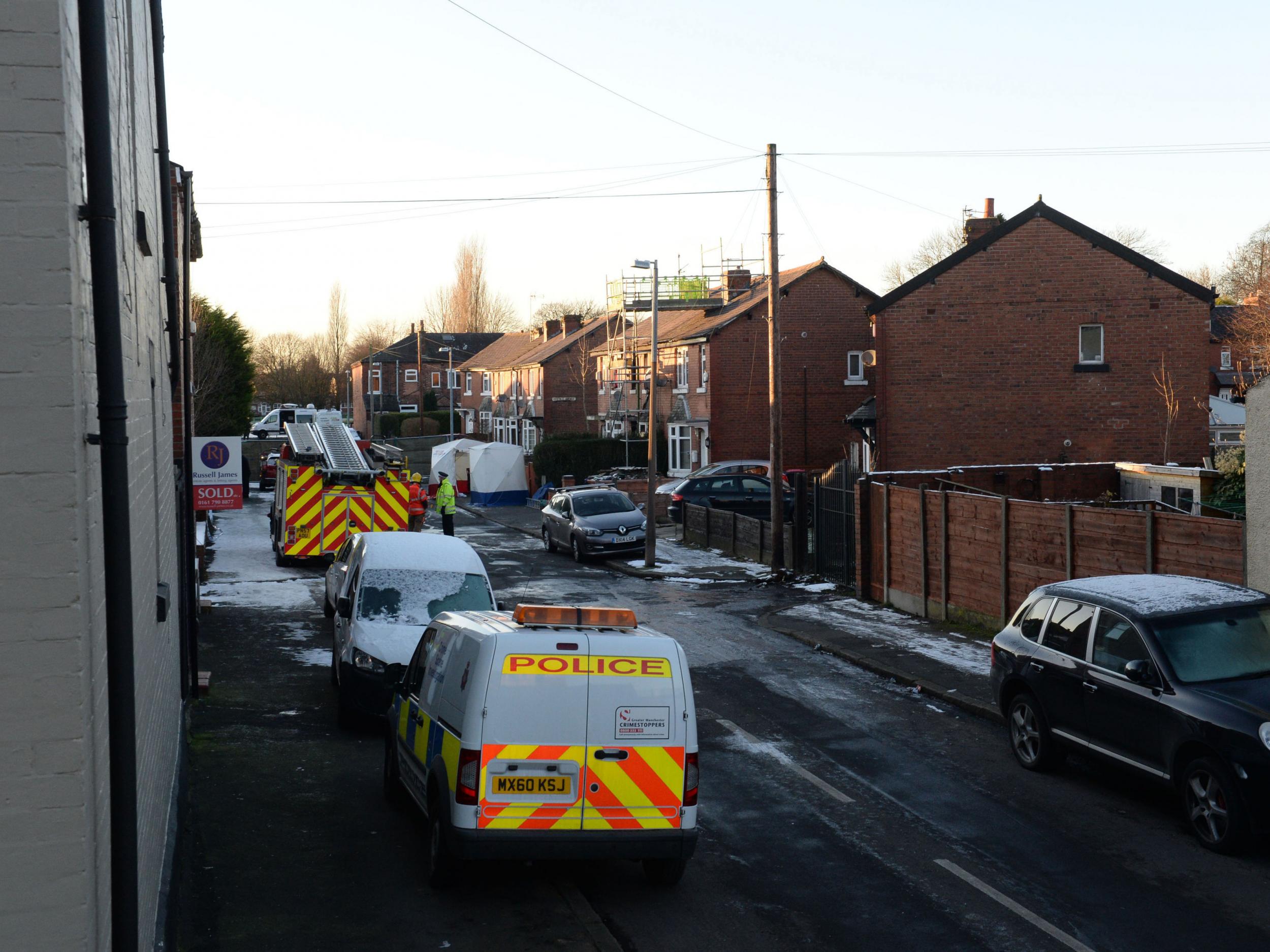 Emergency services at the scene of a house fire on Jackson Street in Worsley, Greater Manchester, as a murder inquiry has been launched after three children died following the fire
