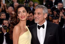 George and Amal Clooney gave out headphones on recent flight