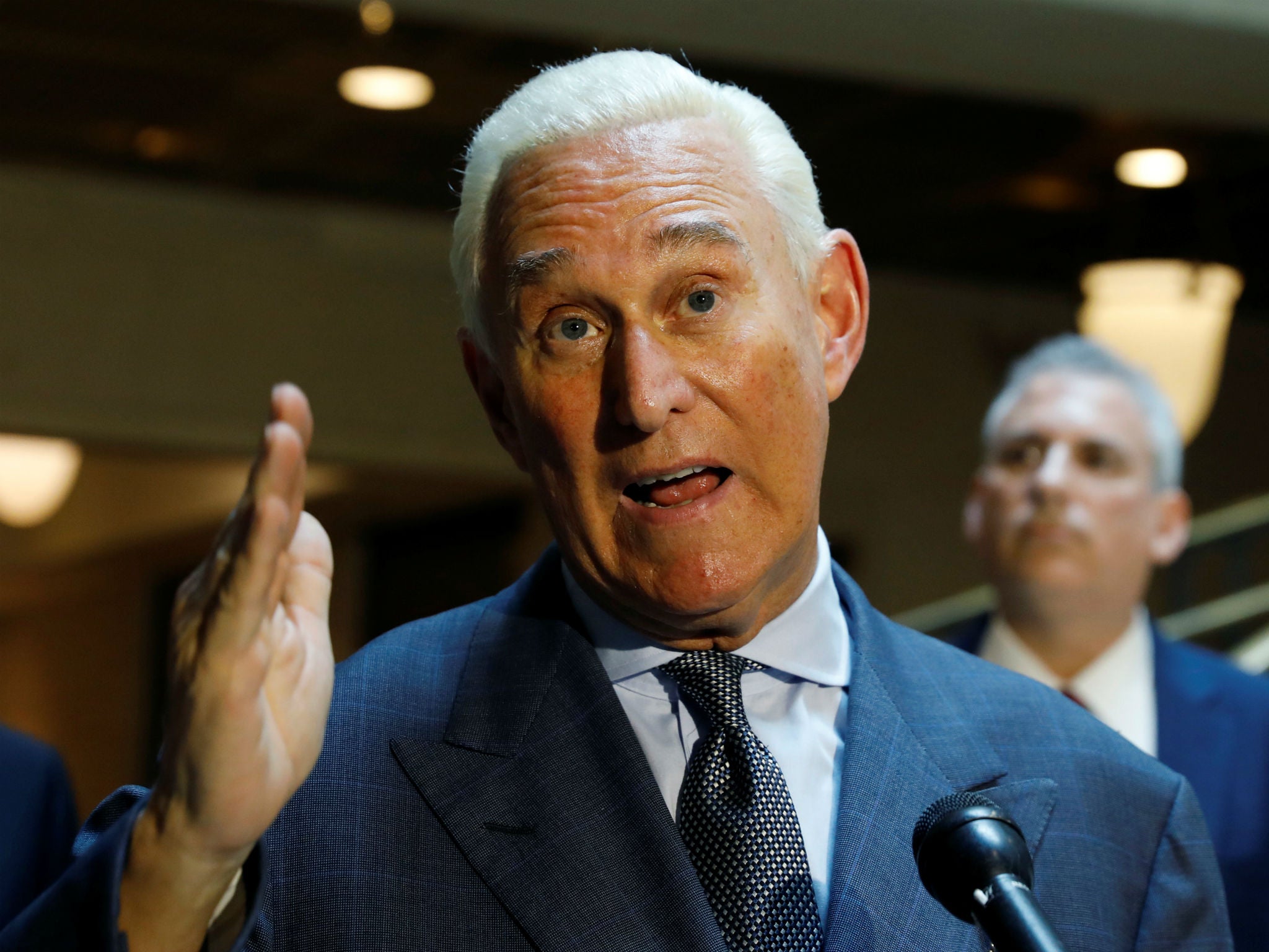 Roger Stone speaks to reporters after appearing before a closed House Intelligence Committee hearing investigating Russian interference in the 2016 presidential election