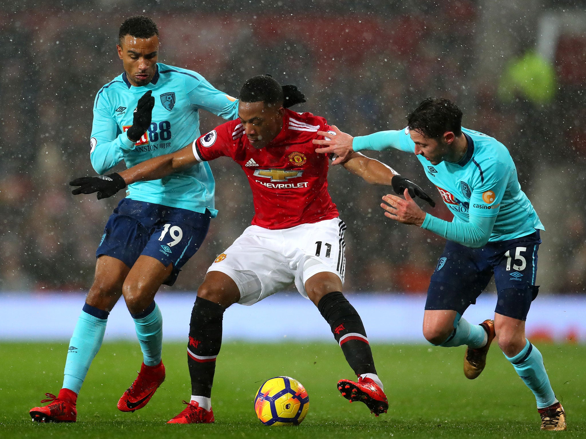 Anthony Martial attempts to hold on to possession under pressure from Bournemouth