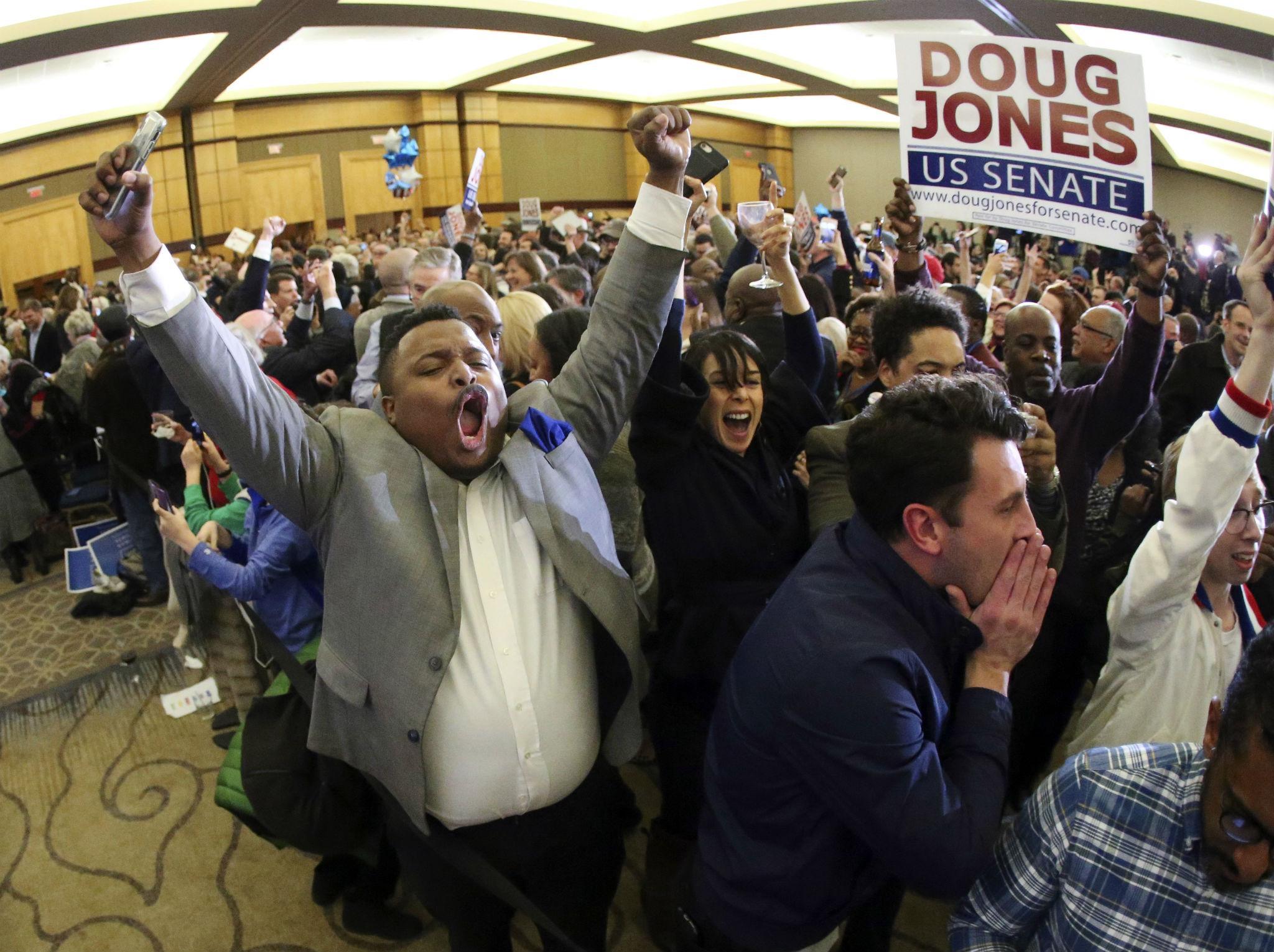 Supporters of Doug Jones erupt is celebration during an election-night watch party Tuesday, Dec. 12, 2017, in Birmingham, Ala