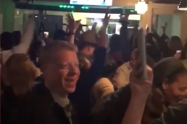 People celebrate in bar after Roy Moore loses
