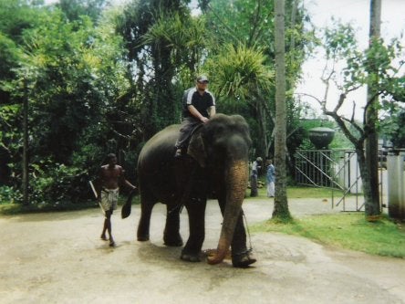 Tony riding an elephant in Sri Lanka