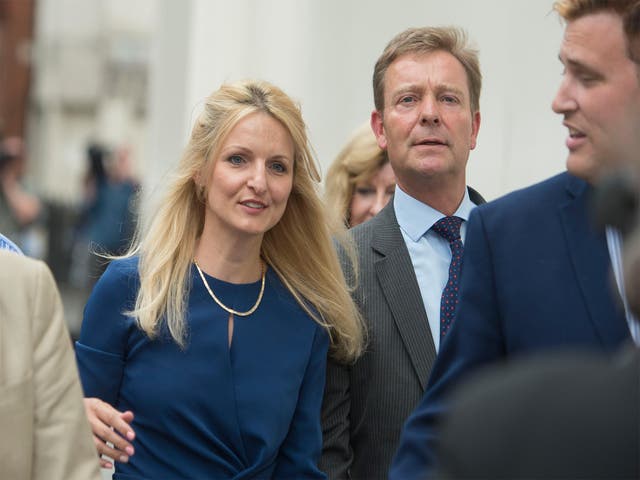 The former UKIP politician Craig Mackinlay (right) arrives at court with his wife Kati Mackinlay
