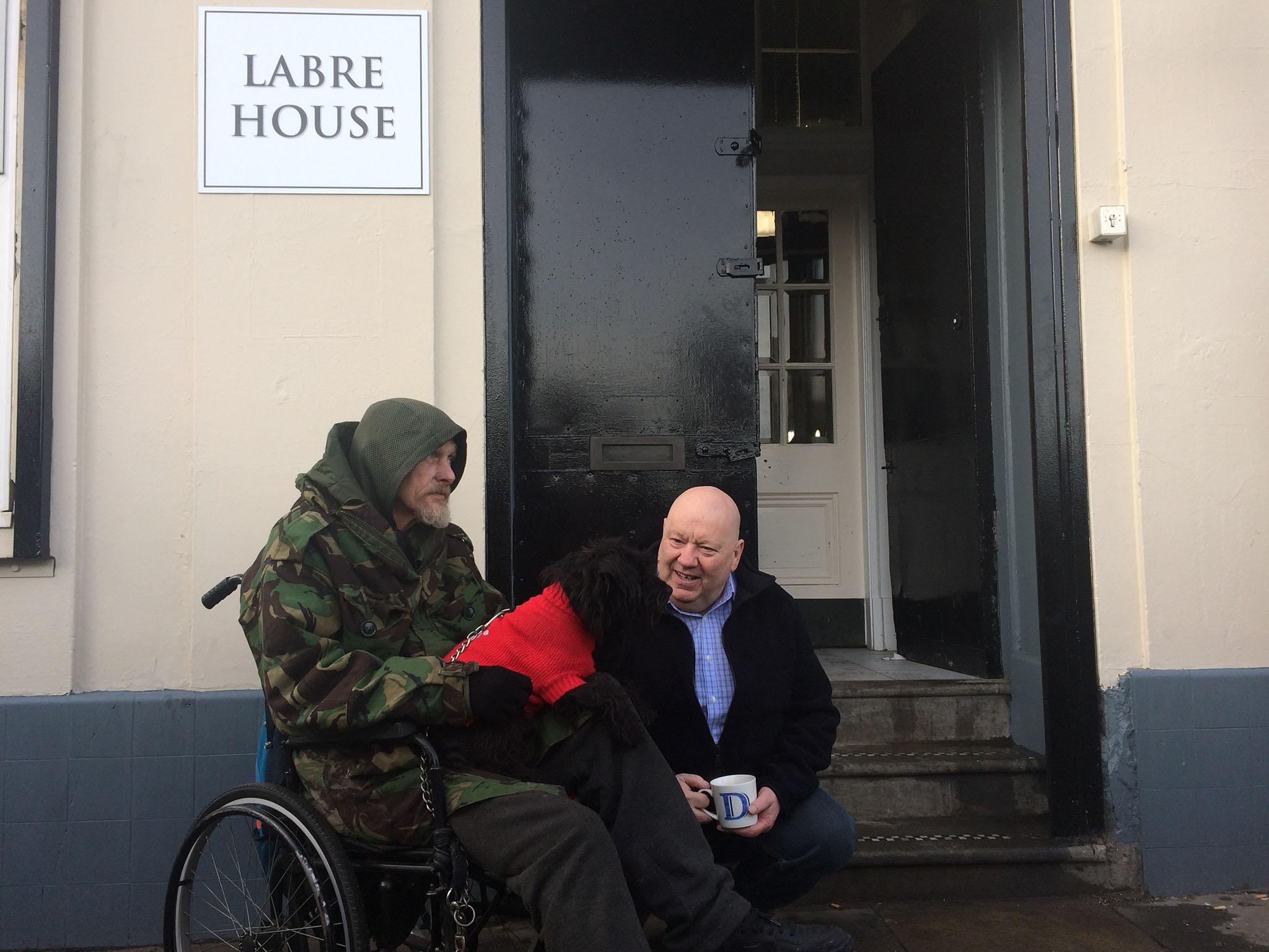 Liverpool Mayor Joe Anderson (right) sits with one of the new residents at the Labre House homeless shelter in the city centre