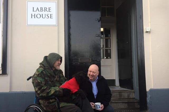 Liverpool Mayor Joe Anderson (right) sits with one of the new residents at the Labre House homeless shelter in the city centre