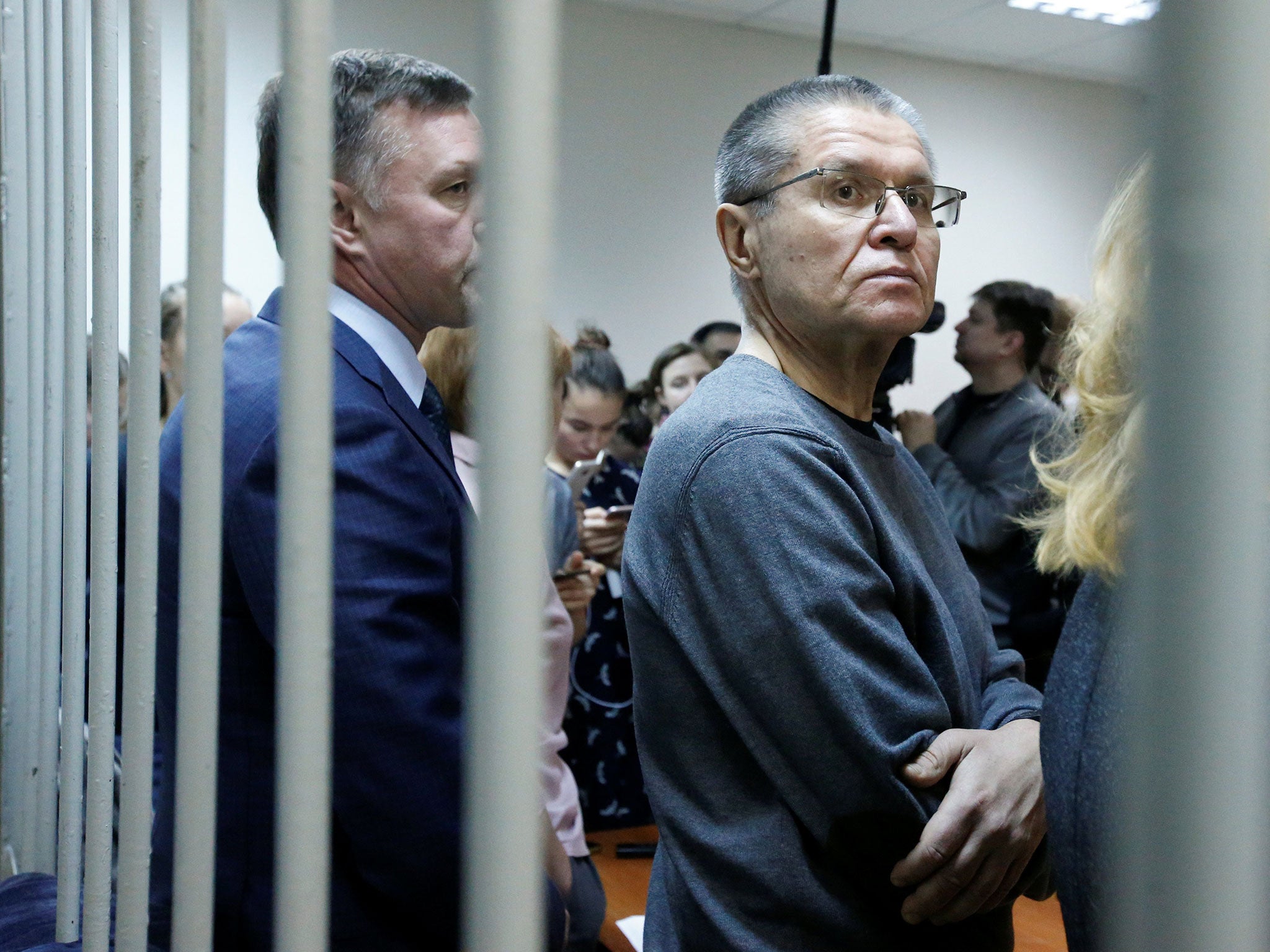 Russia's former economy minister, Alexei Ulyukayev, waits for the start of the court hearing on Friday