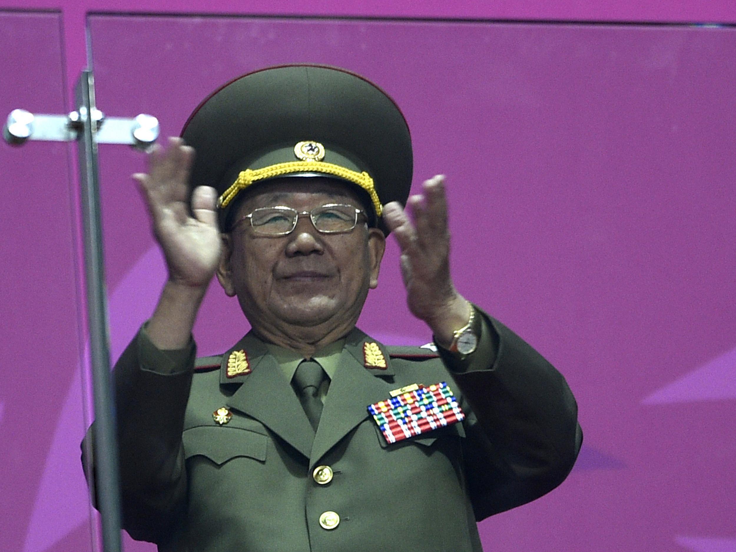 North Korean director of the military's General Political Bureau, the top military post in North Korea, Hwang Pyong-So, stands and applauds as North Korean athletes join athletes from other nations in the arena during the closing ceremony of the 2014 Asian Games at The Incheon Asiad Main Stadium