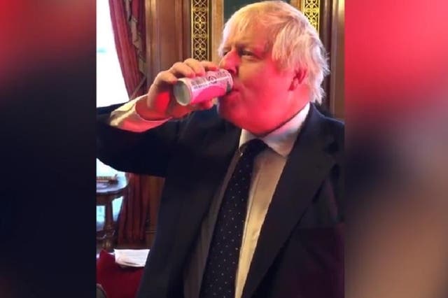 Boris Johnson drinks a can of peach juice from Fukushima, Japan
