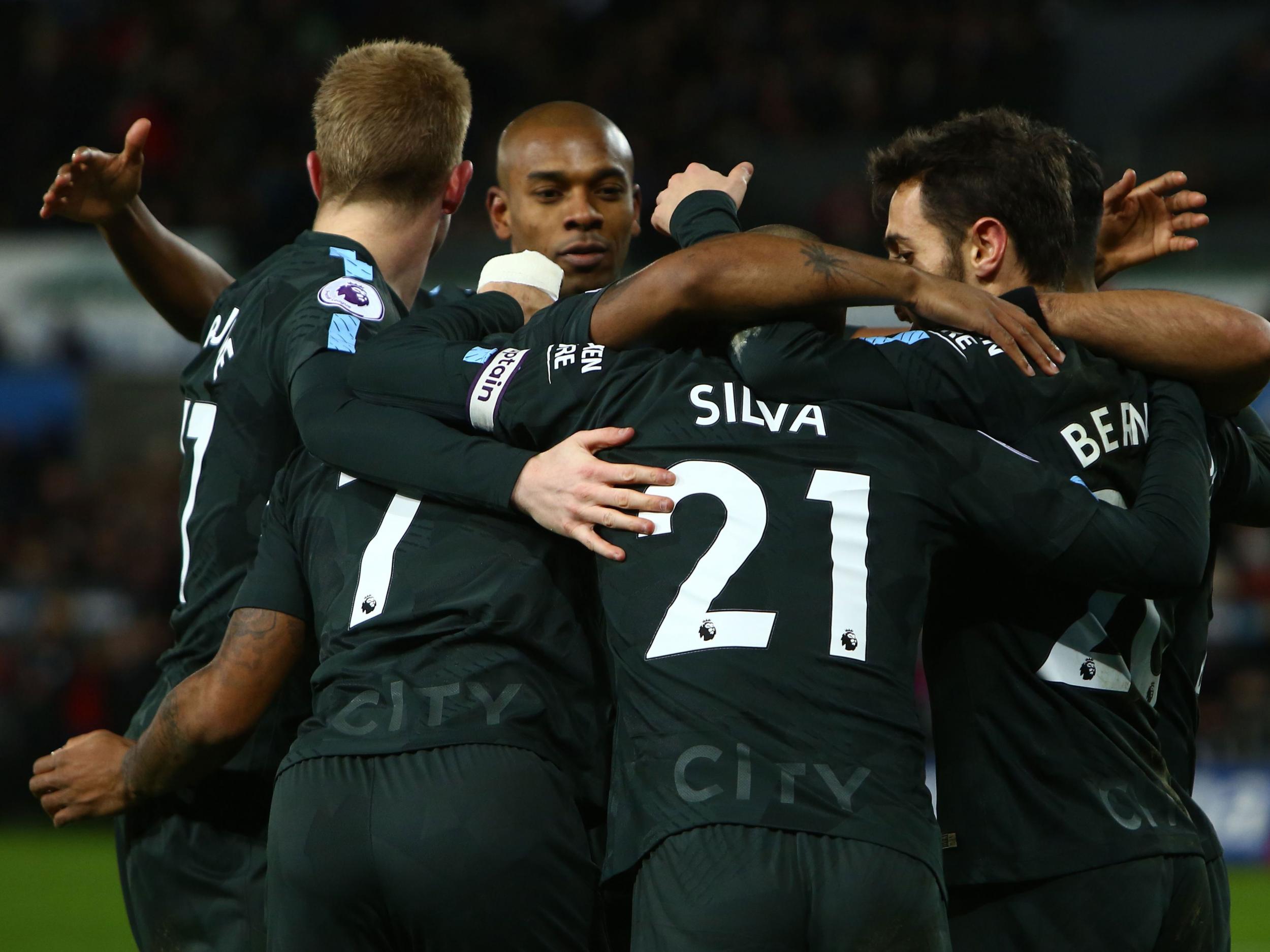Manchester City sit 11 points clear at the top of the Premier League table`