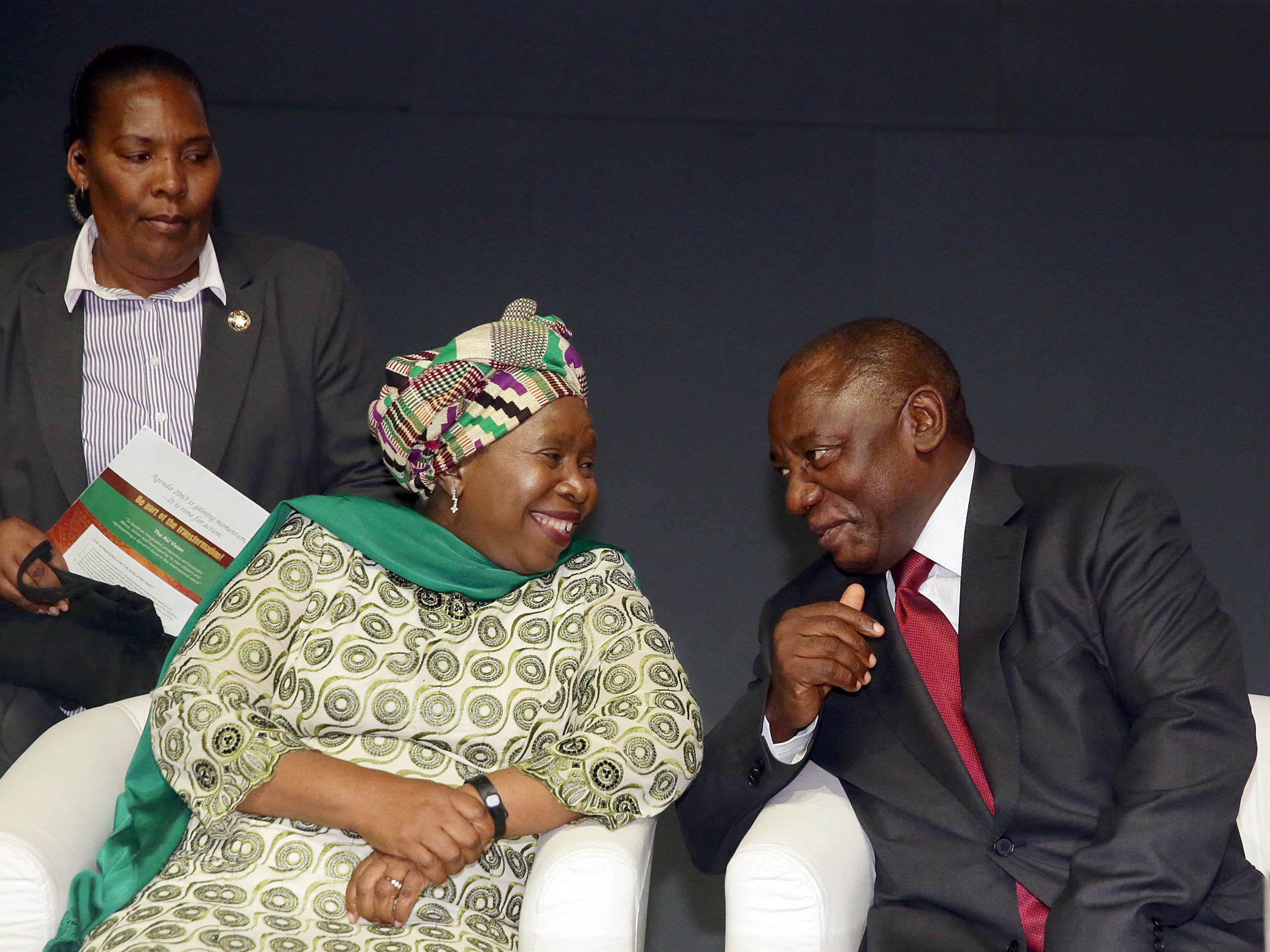 Nkosazana Dlamini-Zuma and Cyril Ramaphosa sharing a light moment at a conference in Durban, South Africa in 2015. If the rift between their two factions is not healed after the vote if could lead to a political crisis