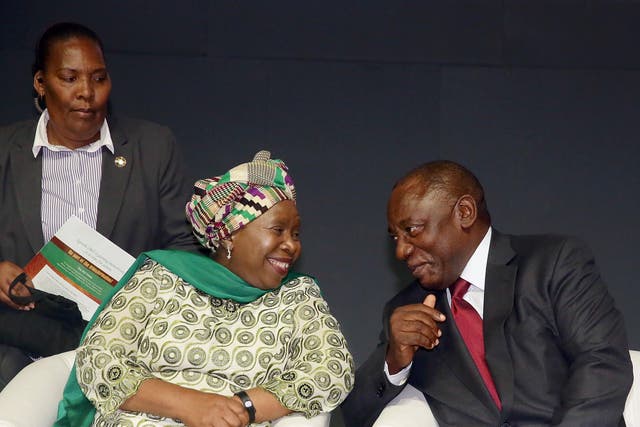 Nkosazana Dlamini-Zuma and Cyril Ramaphosa sharing a light moment at a conference in Durban, South Africa in 2015. If the rift between their two factions is not healed after the vote if could lead to a political crisis